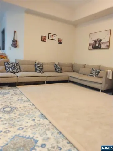 a kitchen with cabinets and wooden floor