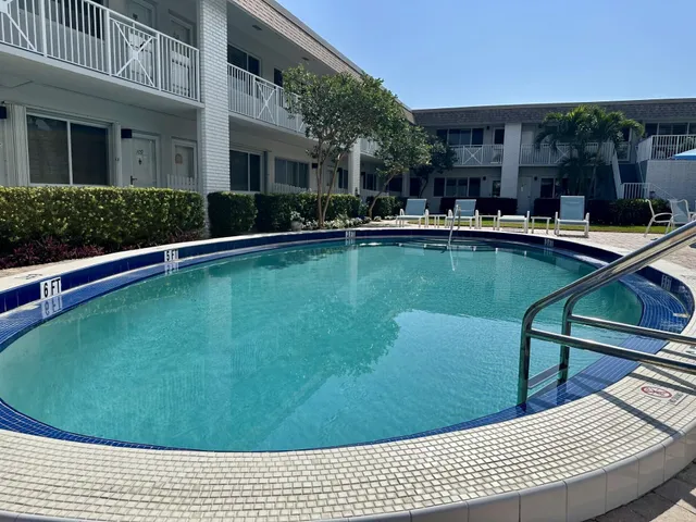 a view of swimming pool with outdoor seating