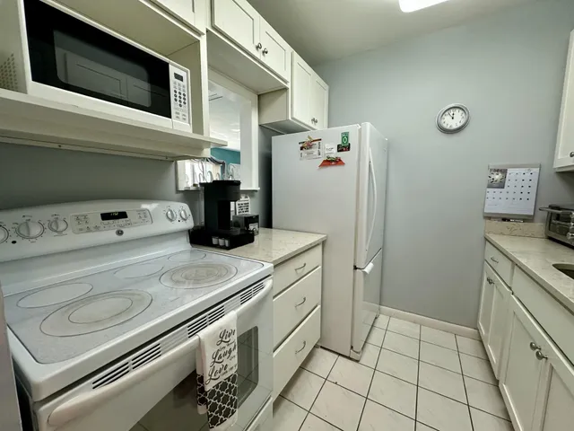 a kitchen with a stove and a microwave
