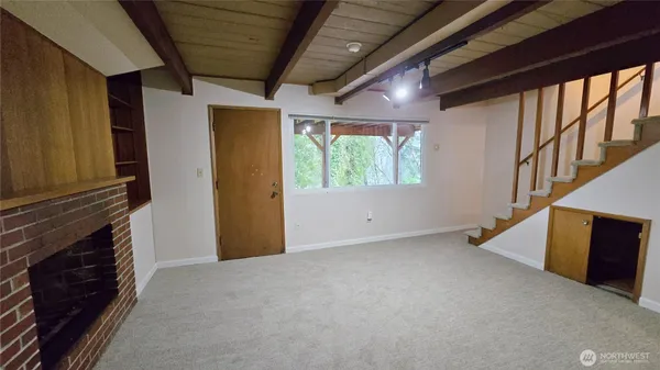 a view of an empty room with a window