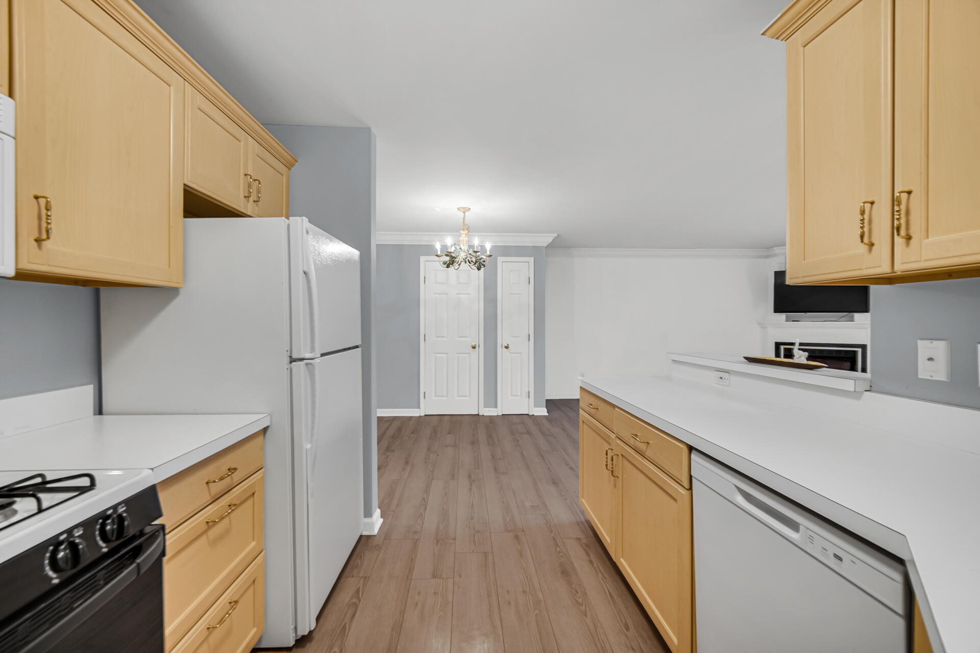 2649 Georgetowne Drive, Unit B2 Highland, IN 46322 - Photo 10 of 20 a kitchen with a refrigerator a stove and wooden floor