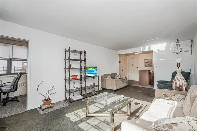 a bedroom with furniture and a gym equipment