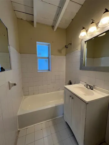 a bathroom with a sink and bathtub