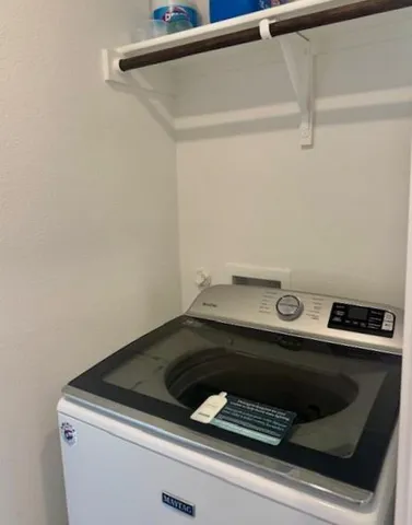 a view of a house with backyard and porch