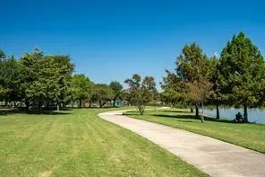 a view of swimming pool with outdoor seating