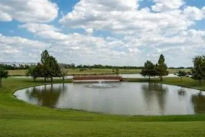 a view of swimming pool with a patio and a yard
