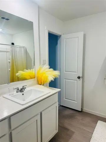 a bathroom with a shower and a toilet
