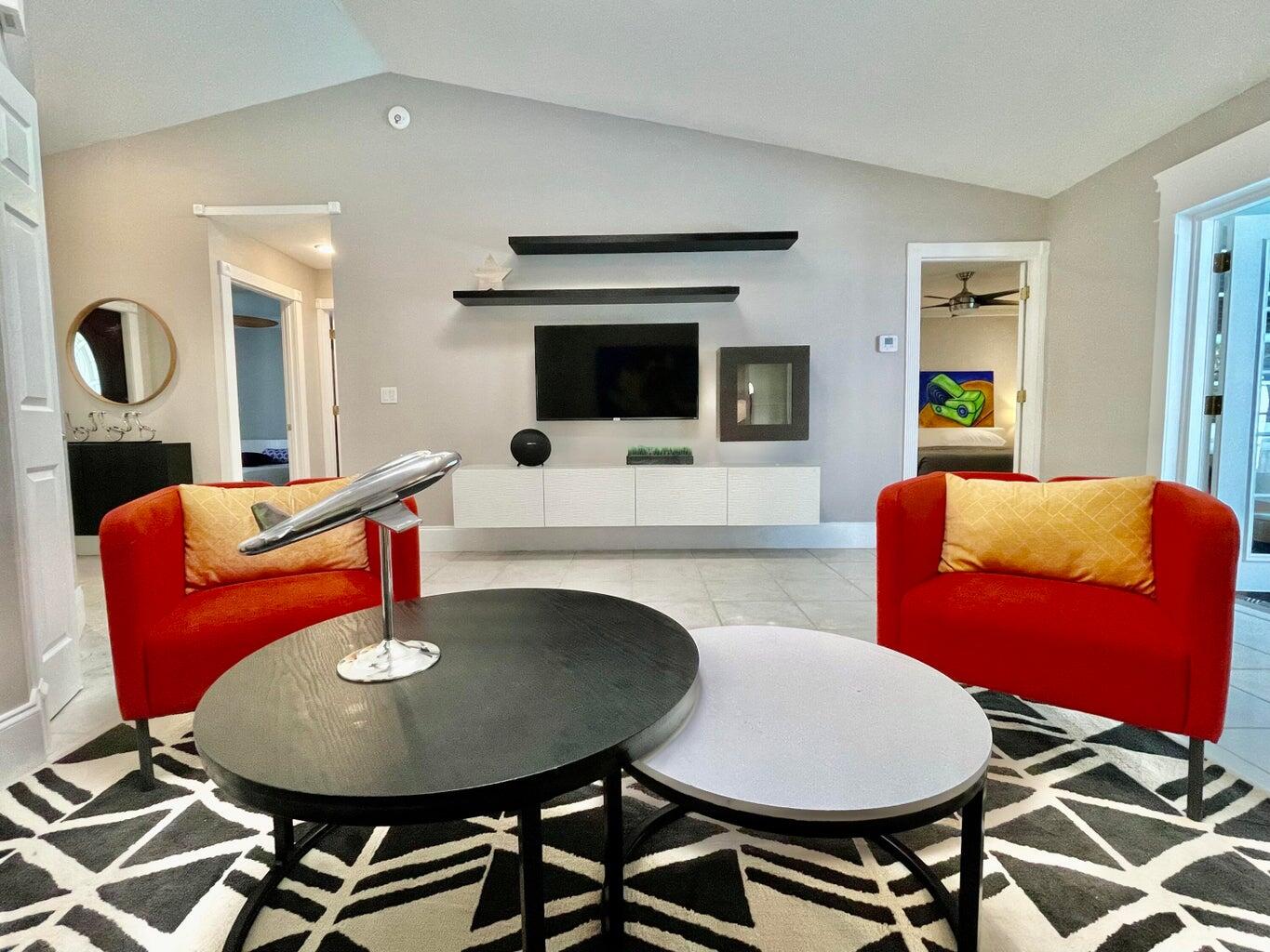 1259 Denlow Lane Royal Palm Beach, FL 33411 - Photo 11 of 40 a living room with furniture a flat screen tv and kitchen view