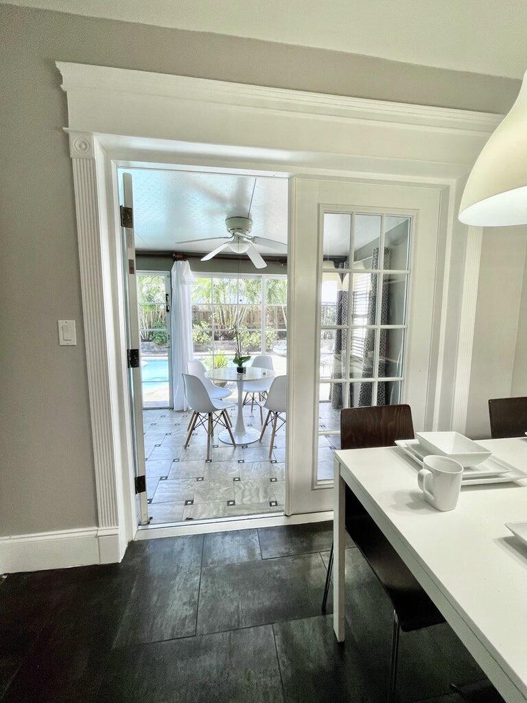 1259 Denlow Lane Royal Palm Beach, FL 33411 - Photo 19 of 40 a dining room with table and chairs