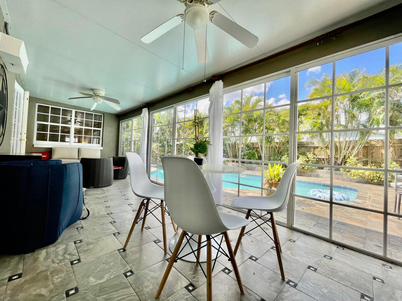1259 Denlow Lane Royal Palm Beach, FL 33411 - Photo 20 of 40 a view of a dining room with furniture window and outside view