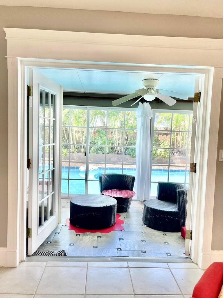1259 Denlow Lane Royal Palm Beach, FL 33411 - Photo 22 of 40 a living room with furniture and a potted plant