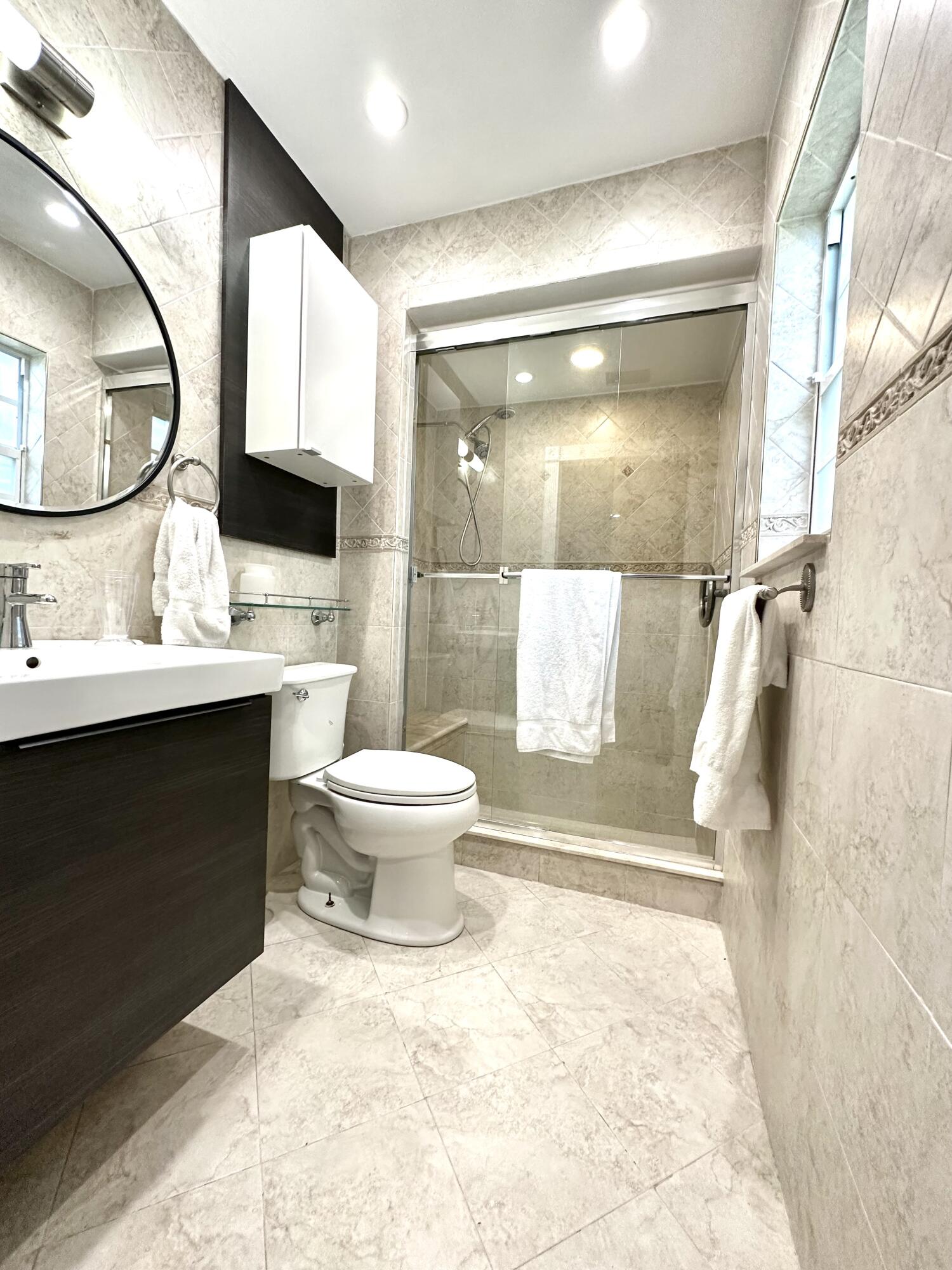 1259 Denlow Lane Royal Palm Beach, FL 33411 - Photo 33 of 40 a bathroom with a sink toilet and shower