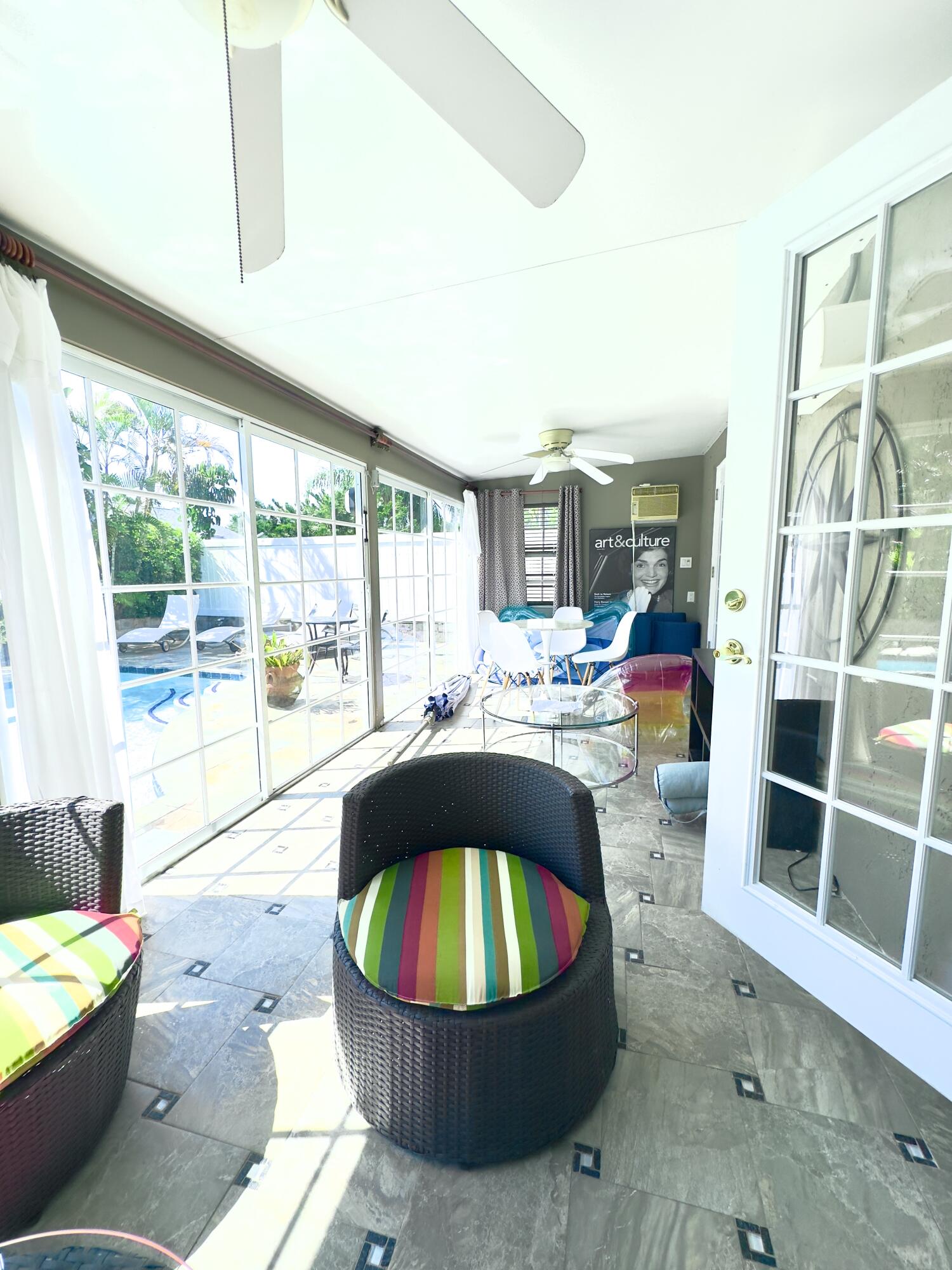 1259 Denlow Lane Royal Palm Beach, FL 33411 - Photo 35 of 40 a living room filled with furniture and a floor to ceiling window