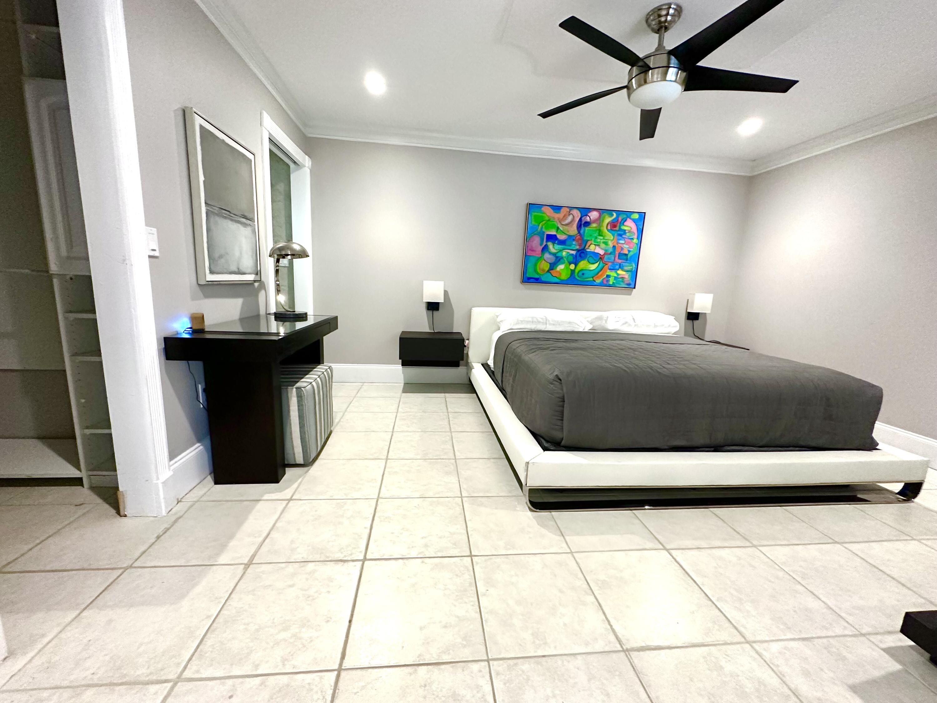 1259 Denlow Lane Royal Palm Beach, FL 33411 - Photo 37 of 40 a living room with a couch and a flat screen tv