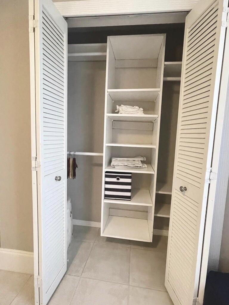 1259 Denlow Lane Royal Palm Beach, FL 33411 - Photo 7 of 40 a view of walk in closet with empty racks