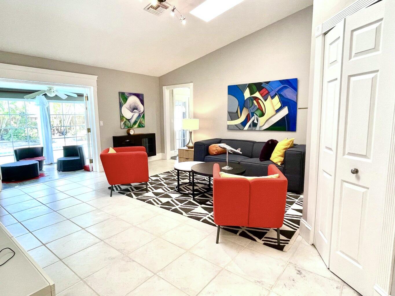 1259 Denlow Lane Royal Palm Beach, FL 33411 - Photo 8 of 40 a living room with furniture a rug and a window