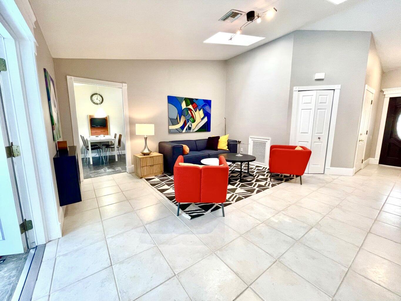 1259 Denlow Lane Royal Palm Beach, FL 33411 - Photo 9 of 40 a bedroom with furniture and a mirror