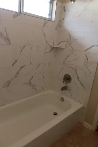 a bathroom with a bathtub