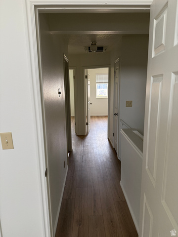 747 Hanover Drive Orem, UT 84058 - Photo 16 of 30 Hallway featuring baseboards and dark wood-style floors