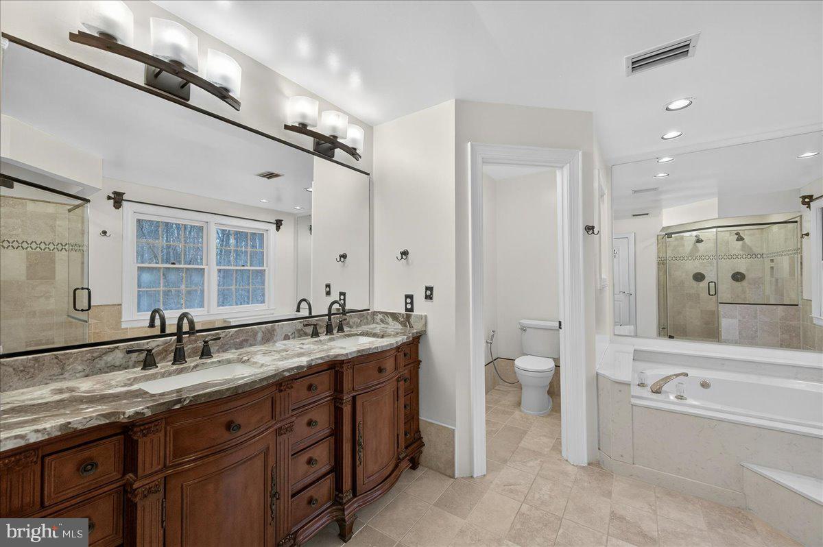 6612 Colchester Road Clifton, VA 20124 - Photo 40 of 93 Stone counters and furniture grand vanity
