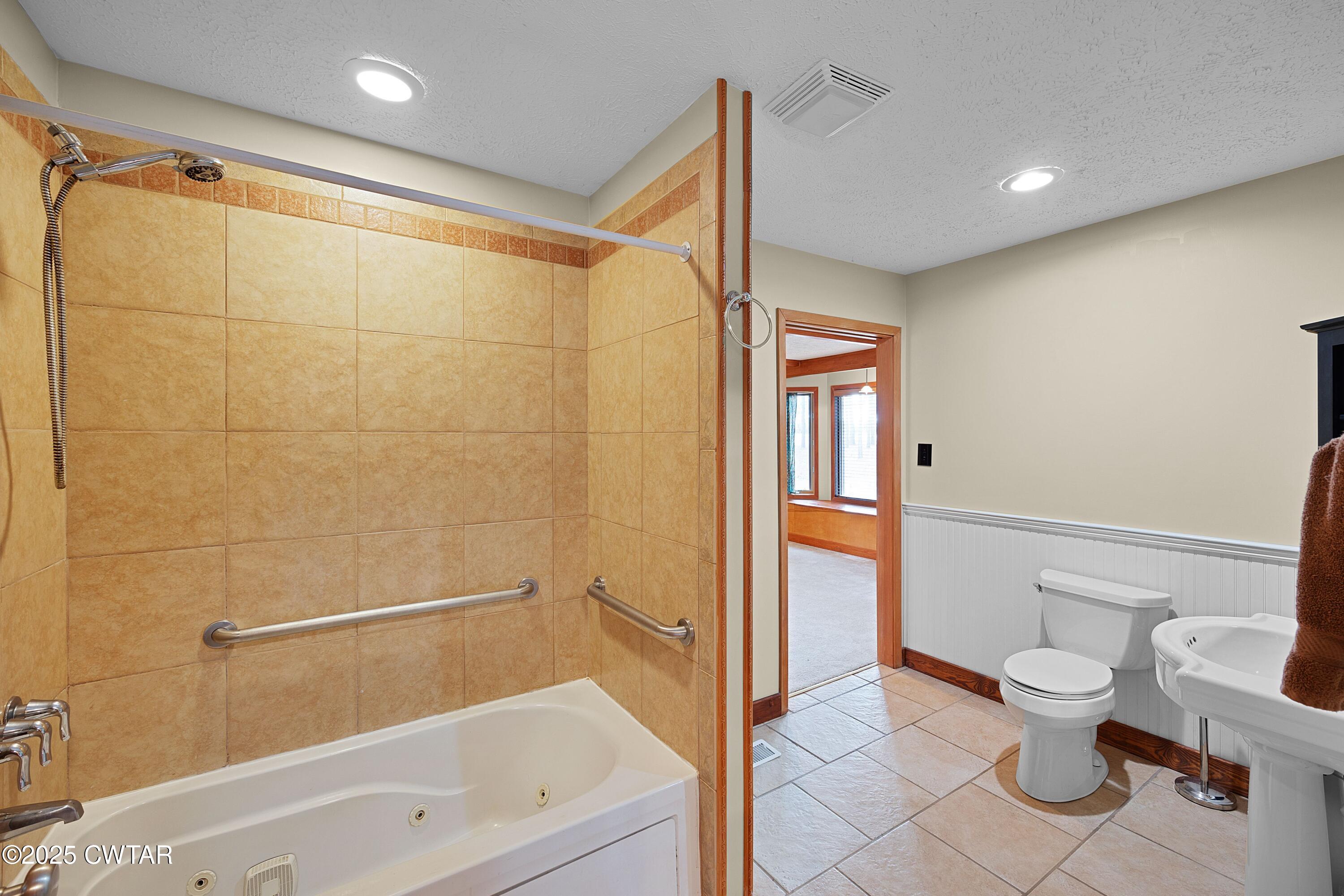 1273 Palmer Road Lexington, TN 38351 - Photo 21 of 62 a bathroom with a toilet and a shower
