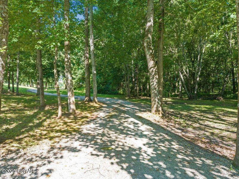 1273 Palmer Road Lexington, TN 38351 - Photo 34 of 62 a backyard of a house with lots of green space