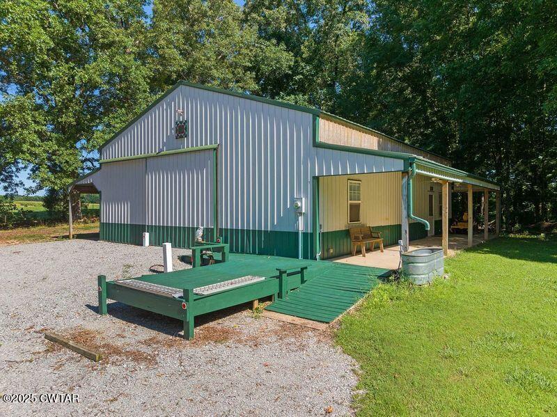 1273 Palmer Road Lexington, TN 38351 - Photo 58 of 62 a view of a house with backyard sitting area and garden