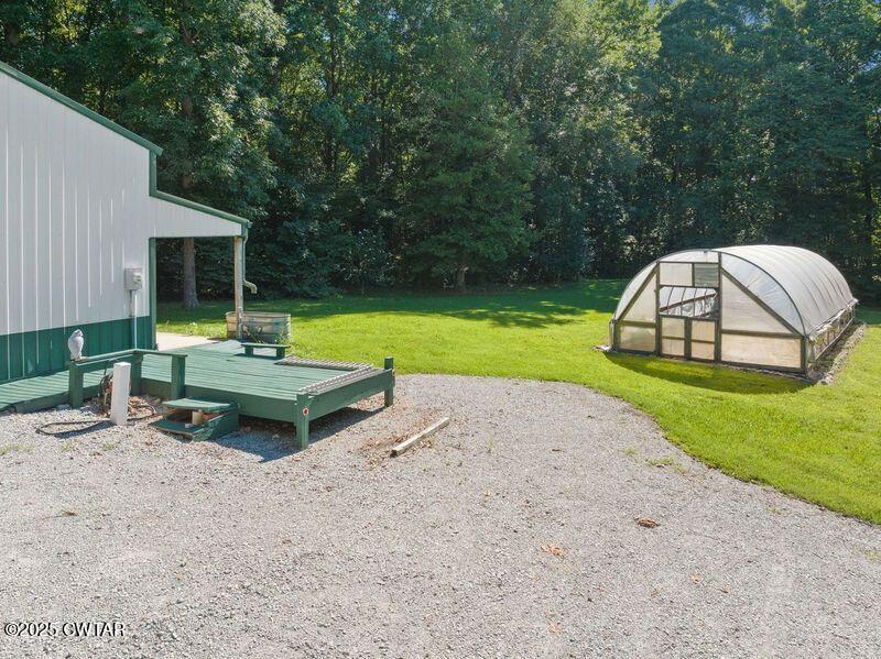 1273 Palmer Road Lexington, TN 38351 - Photo 62 of 62 a view of a backyard with a garden and entertaining space