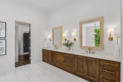 a spacious bathroom with a double vanity sink and a mirror