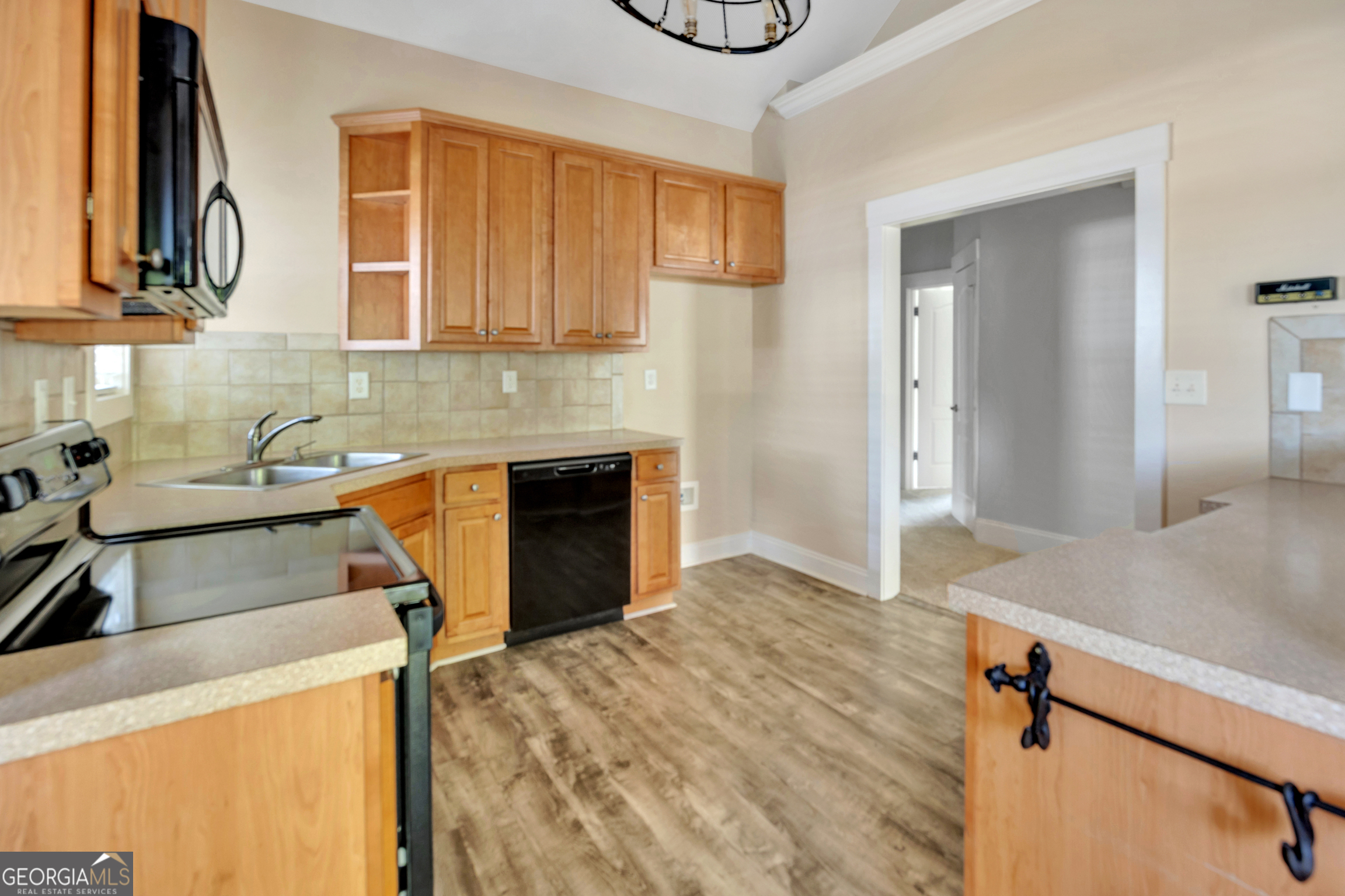205 Ryan Lane Covington, GA 30014 - Photo 12 of 37 a kitchen that has a sink and a stove in it