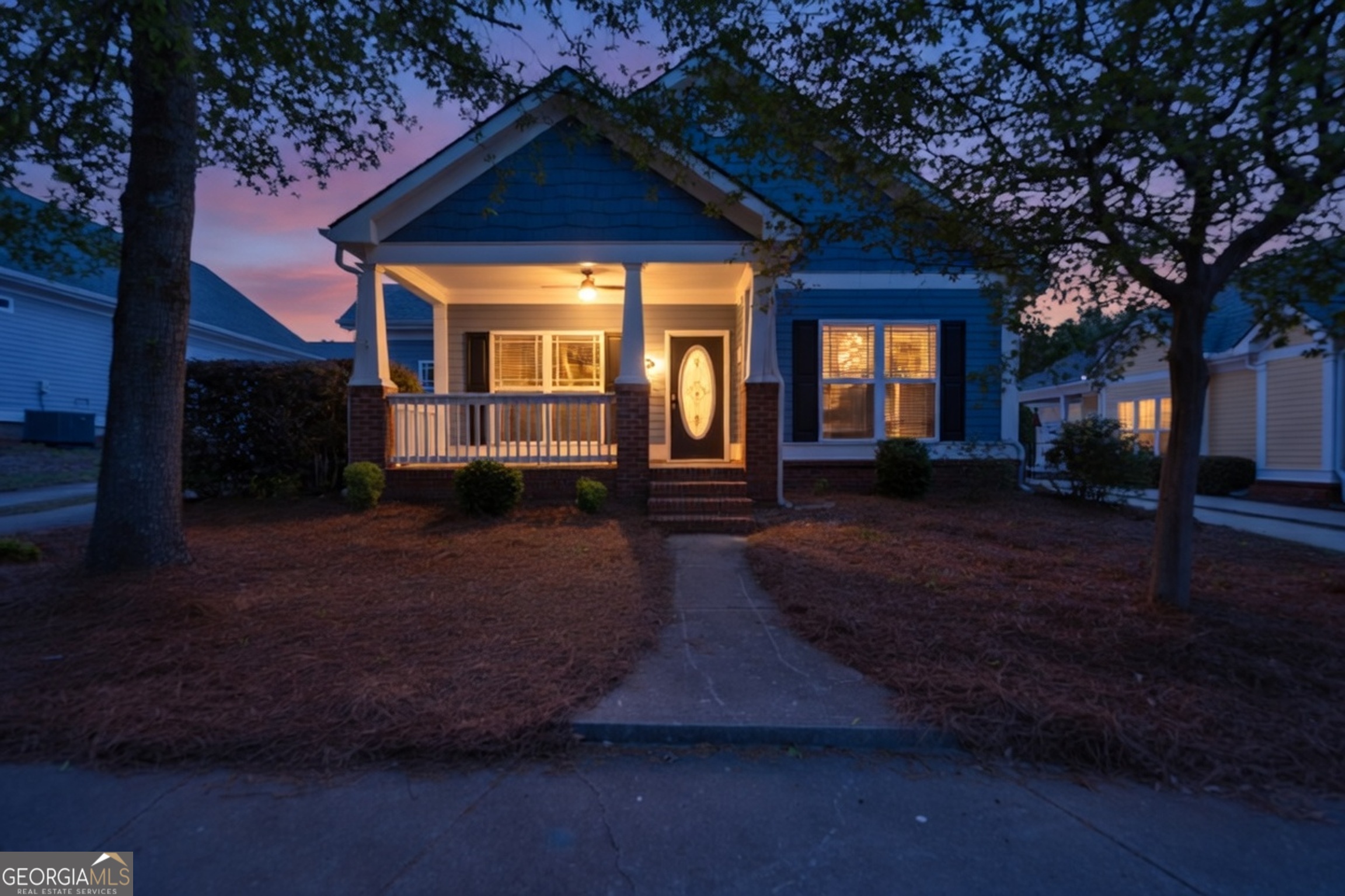 205 Ryan Lane Covington, GA 30014 - Photo 2 of 37 a front view of a house with garden