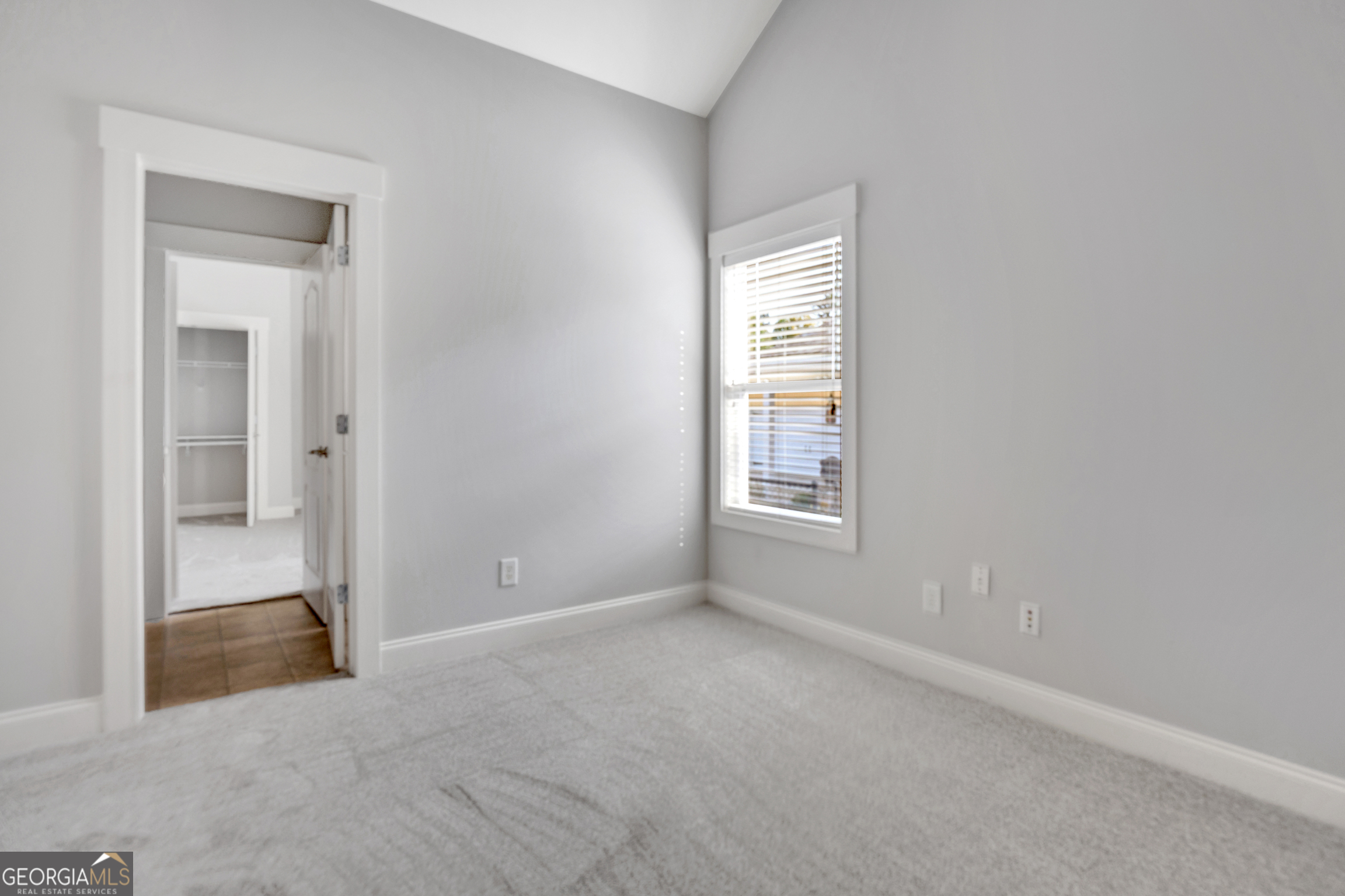 205 Ryan Lane Covington, GA 30014 - Photo 23 of 37 an empty room with windows and closet