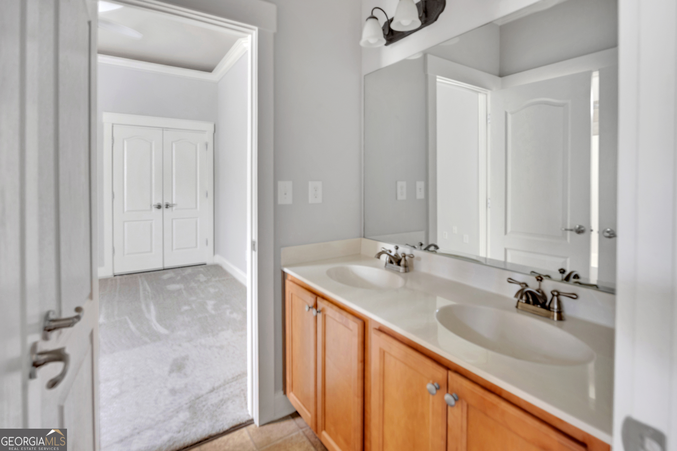 205 Ryan Lane Covington, GA 30014 - Photo 25 of 37 a bathroom with a sink and a mirror