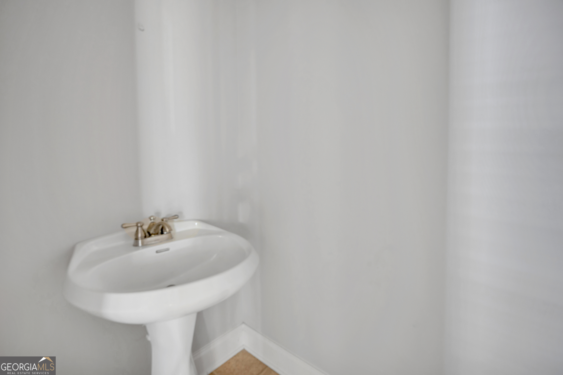 205 Ryan Lane Covington, GA 30014 - Photo 28 of 37 a bathroom with a sink and a mirror