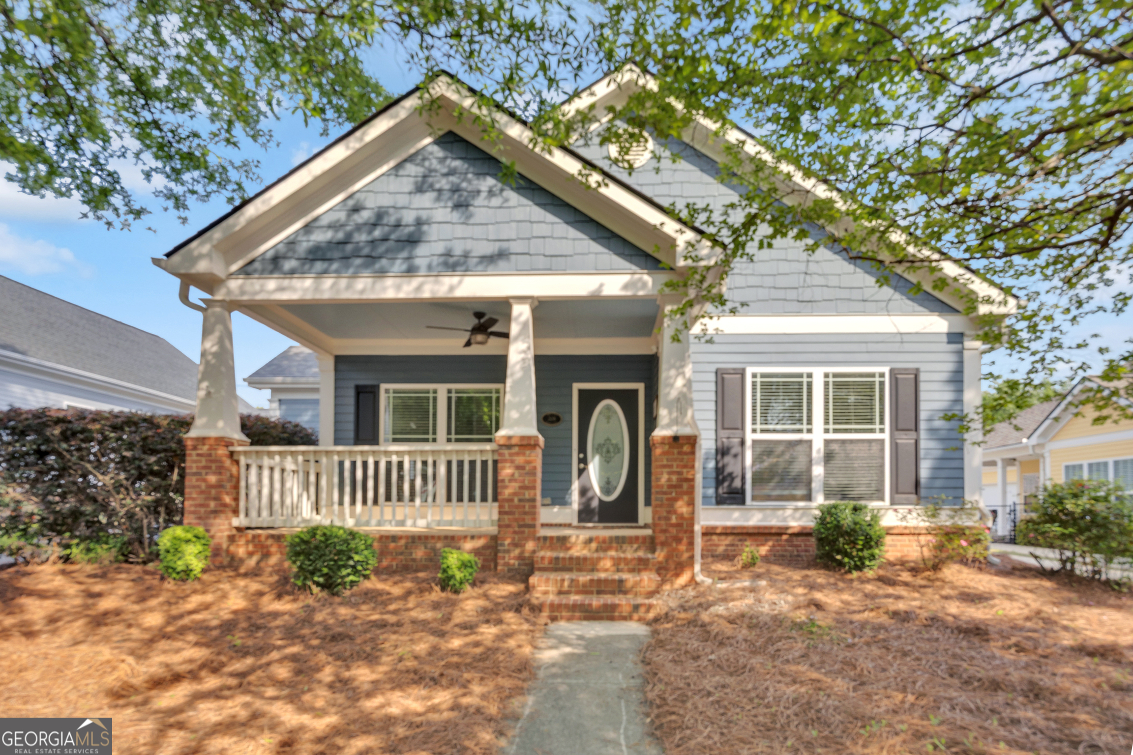 205 Ryan Lane Covington, GA 30014 - Photo 3 of 37 a front view of a house with garden