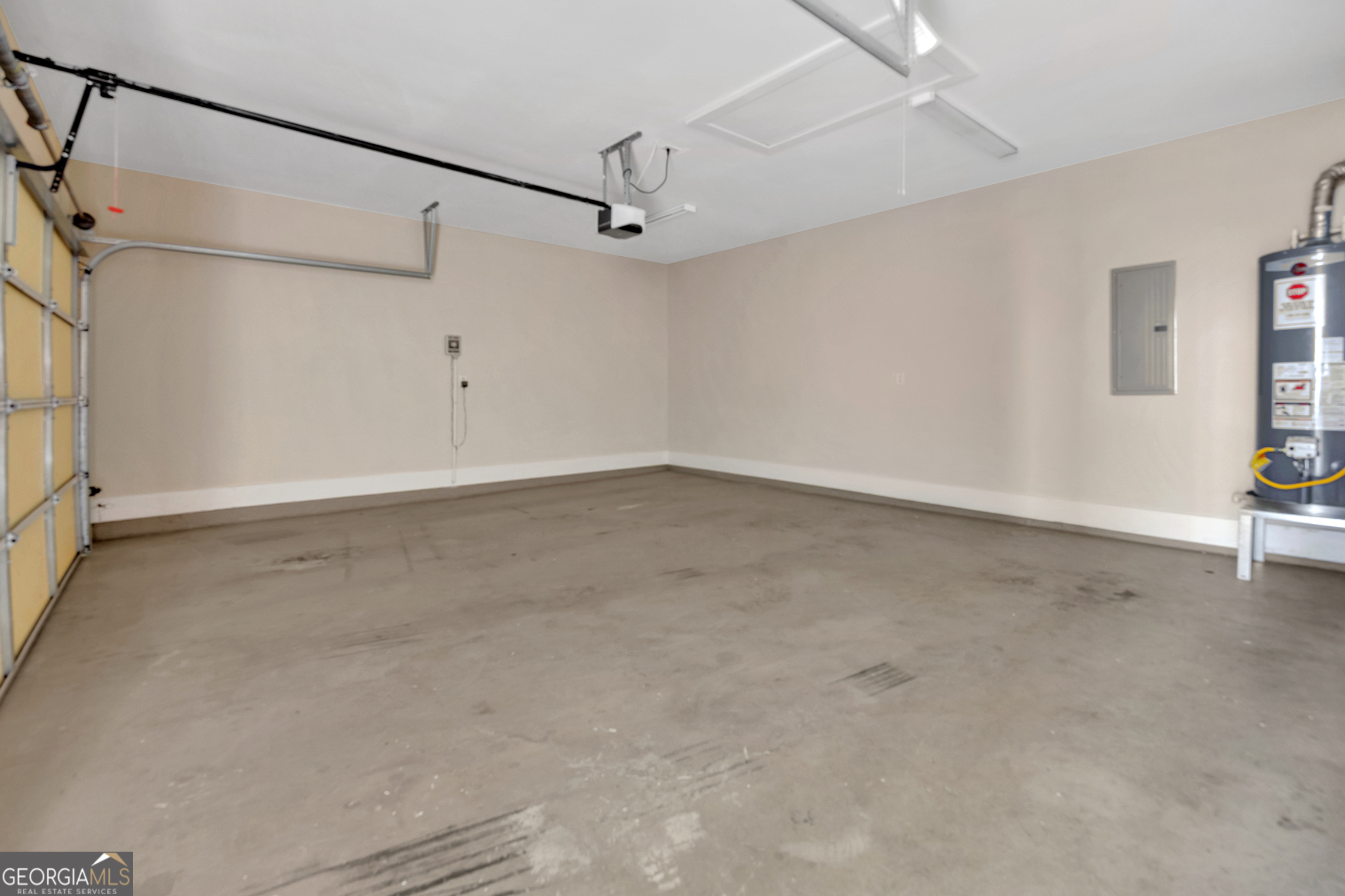 205 Ryan Lane Covington, GA 30014 - Photo 31 of 37 en empty room with ceiling fan and windows