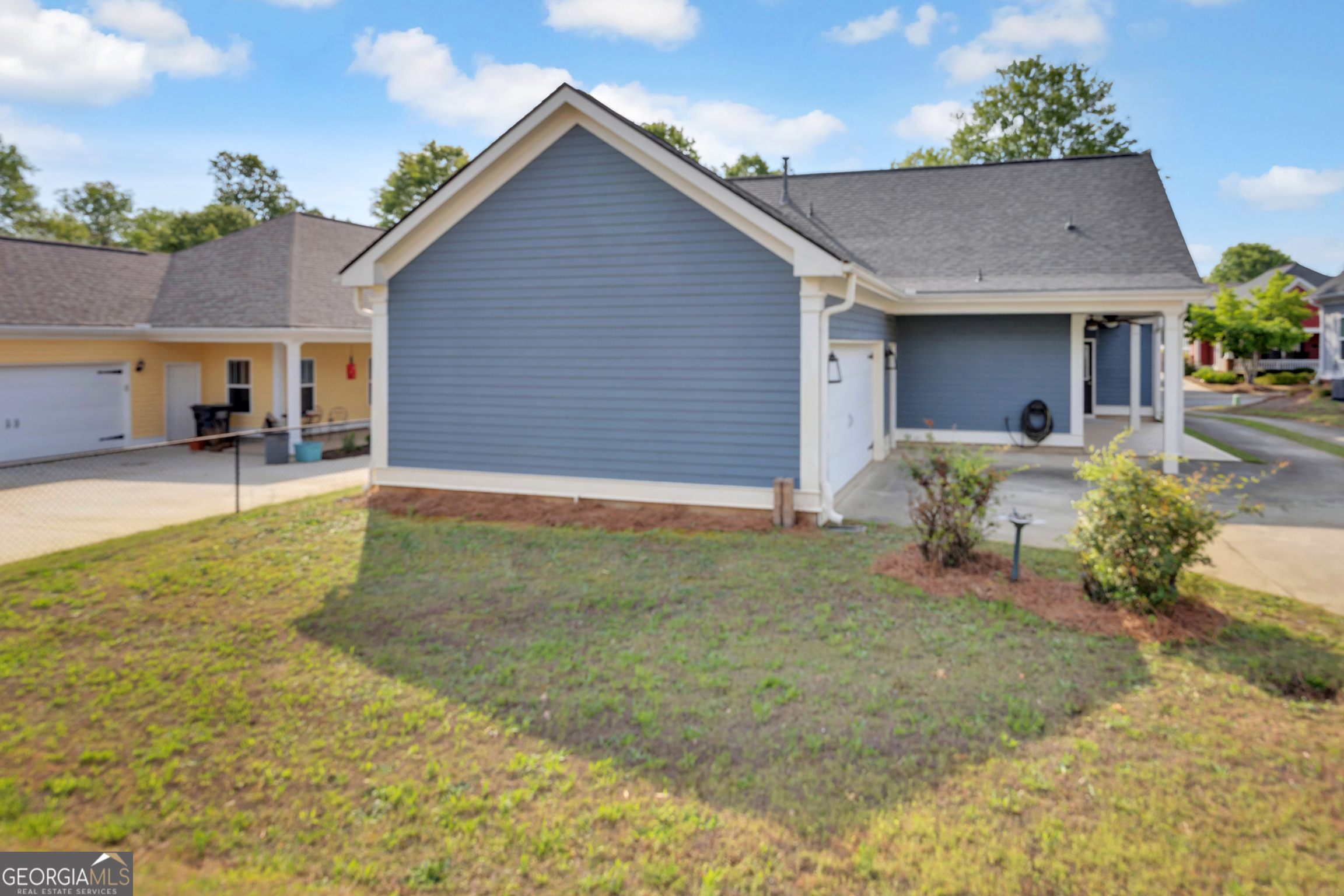 205 Ryan Lane Covington, GA 30014 - Photo 34 of 37 a view of a house with backyard and sitting area
