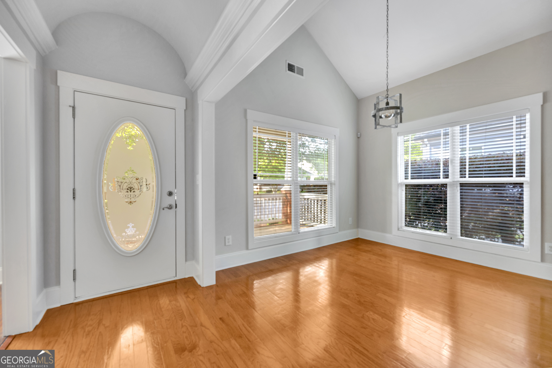 205 Ryan Lane Covington, GA 30014 - Photo 6 of 37 a view of a room with wooden floor and window