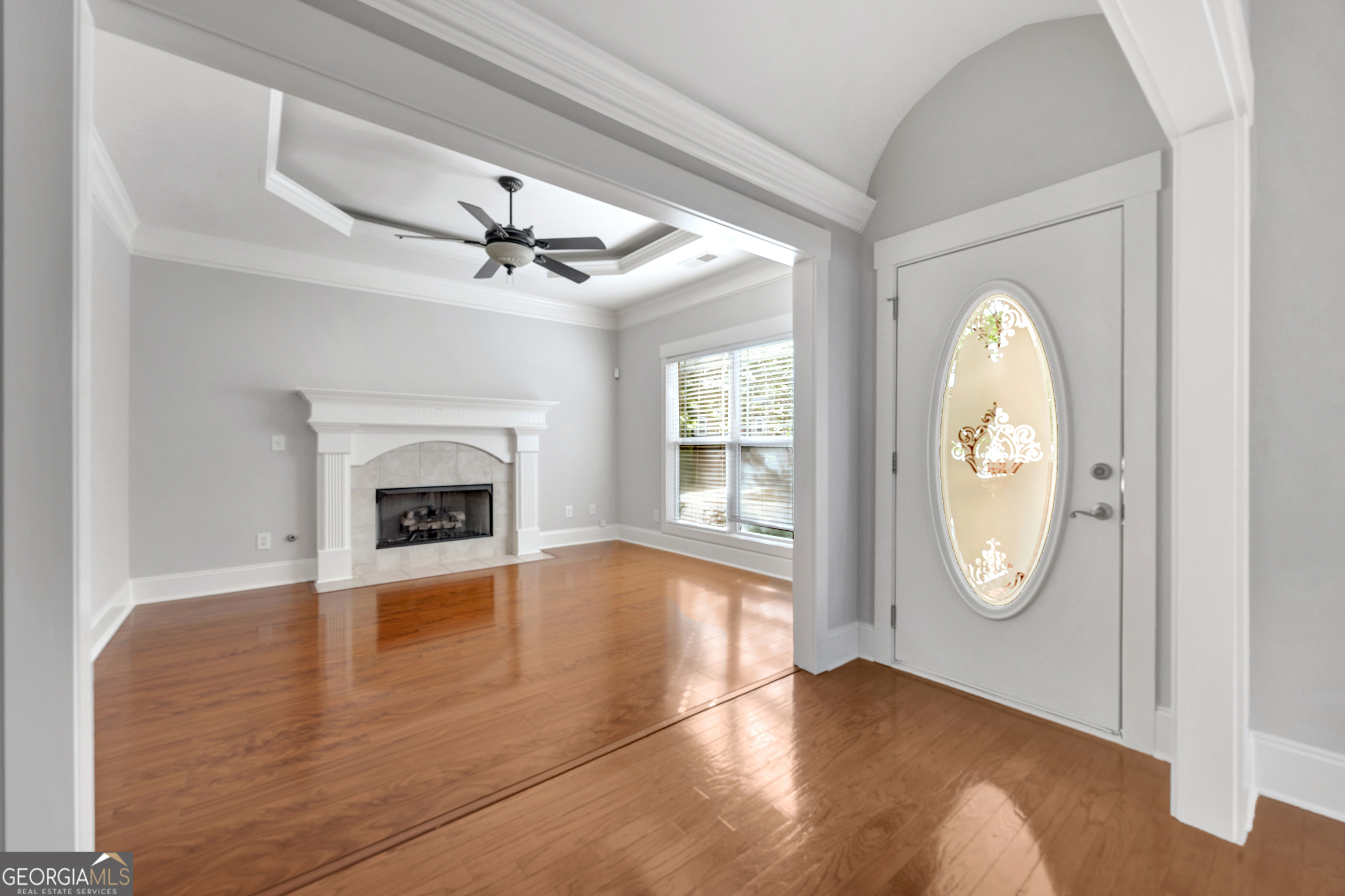 205 Ryan Lane Covington, GA 30014 - Photo 7 of 37 an empty room with windows and a fireplace