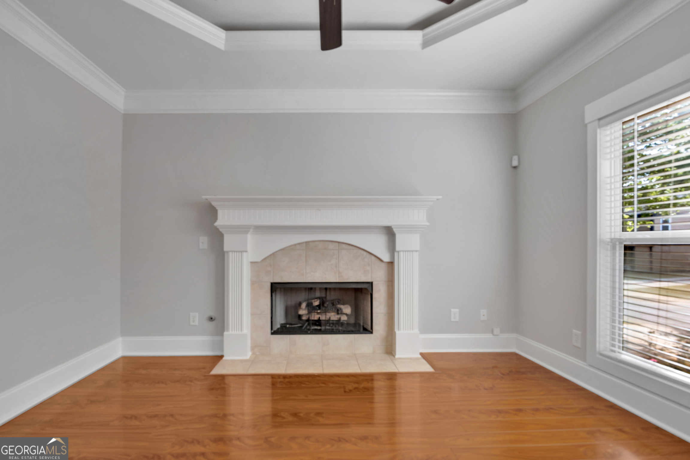 205 Ryan Lane Covington, GA 30014 - Photo 8 of 37 a room with a fireplace and a fireplace