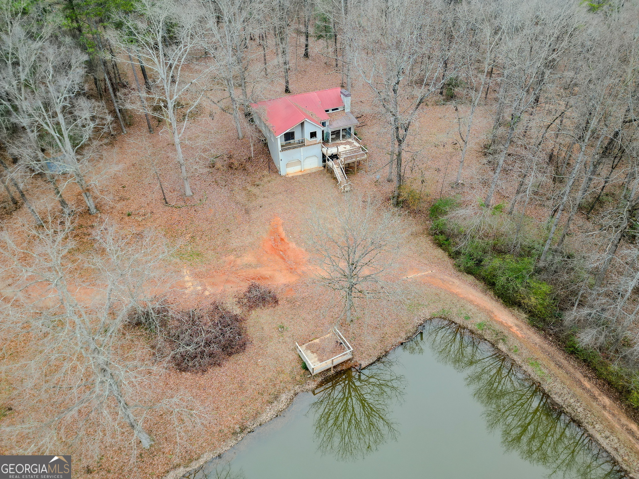 1311 Sam Cooper Road Watkinsville, GA 30677 - Photo 1 of 1 a view of a lake with a yard and mountain view