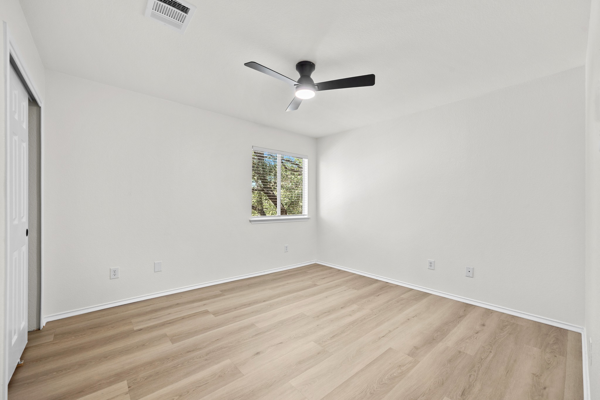 1818 Lost Maples Loop Cedar Park, TX 78613 - Photo 24 of 38 A quiet bedroom featuring resilient laminate flooring and a ceiling fan for optimal comfort.