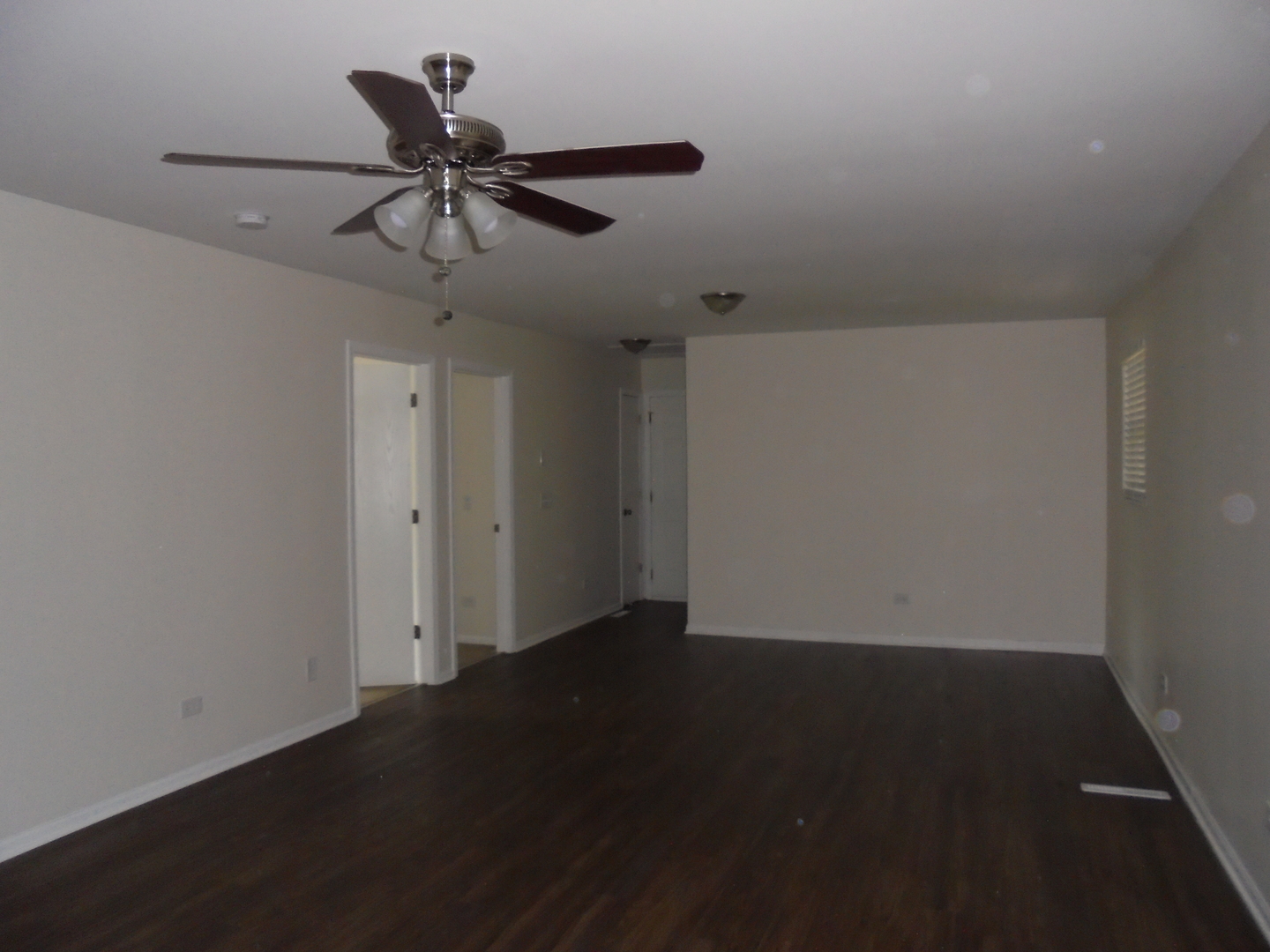 660 West Nippersink Road Round Lake, IL 60073 - Photo 11 of 24 a view of an empty room with a ceiling fan
