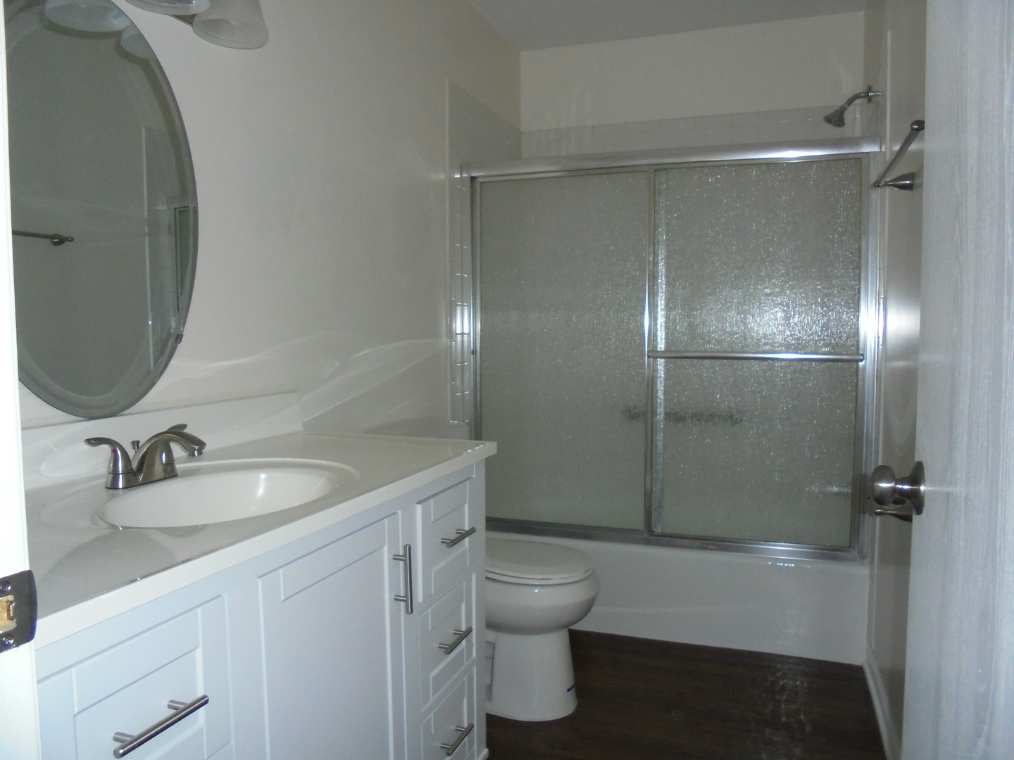 660 West Nippersink Road Round Lake, IL 60073 - Photo 16 of 24 a bathroom with a granite countertop sink toilet and shower