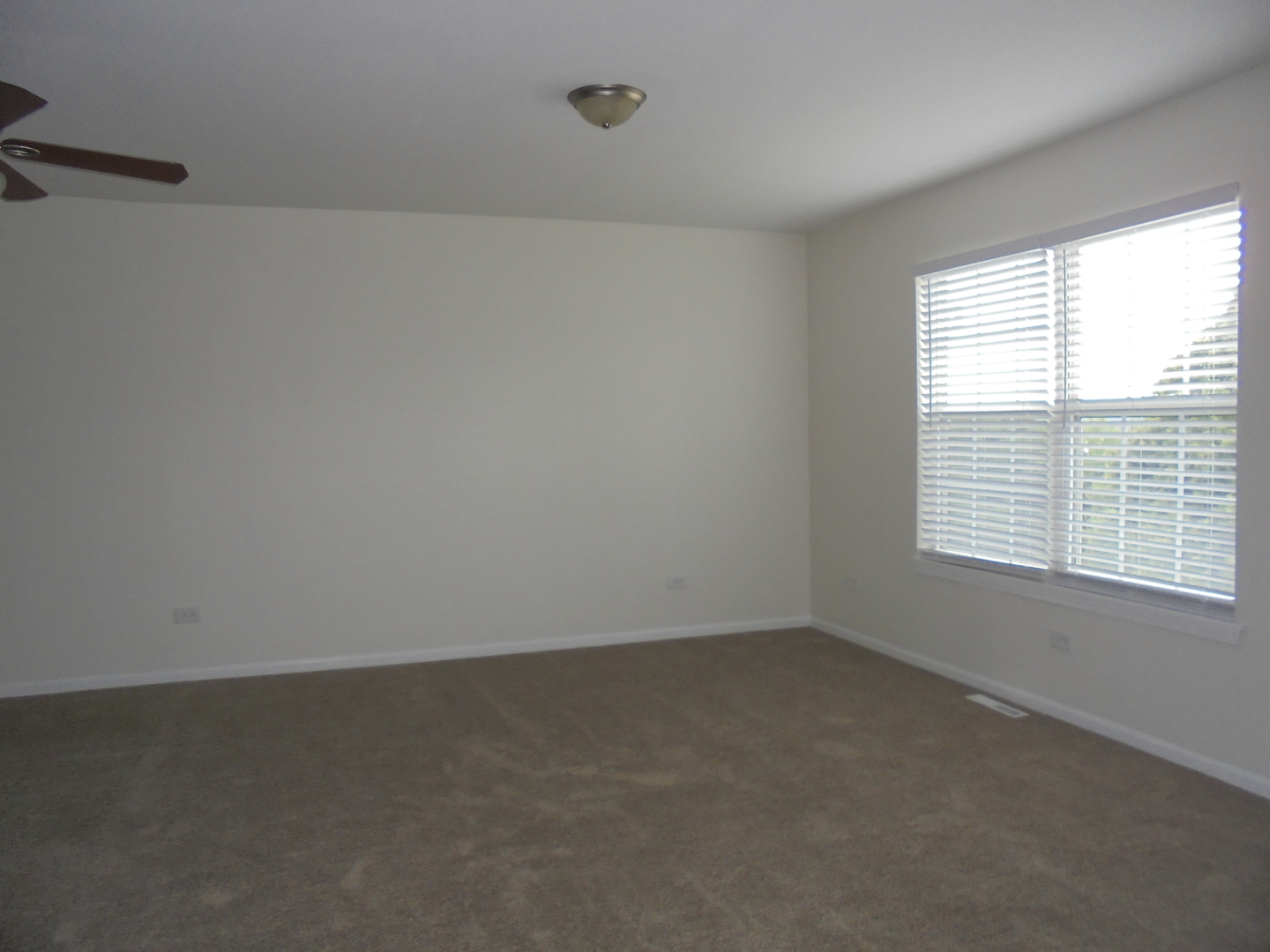 660 West Nippersink Road Round Lake, IL 60073 - Photo 17 of 24 a view of an empty room with a window