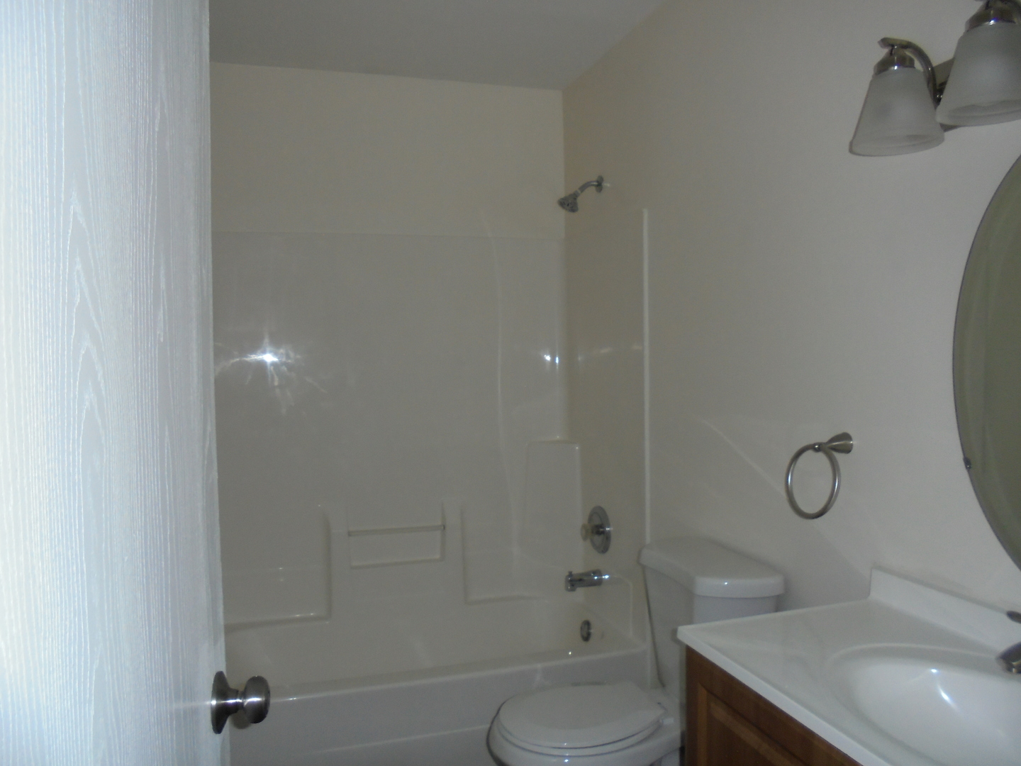 660 West Nippersink Road Round Lake, IL 60073 - Photo 21 of 24 a bathroom with a granite countertop sink toilet and shower