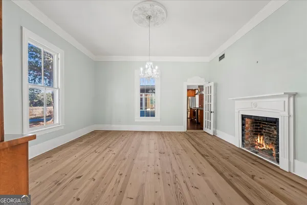 a kitchen with stainless steel appliances granite countertop a sink a stove and a wooden cabinets