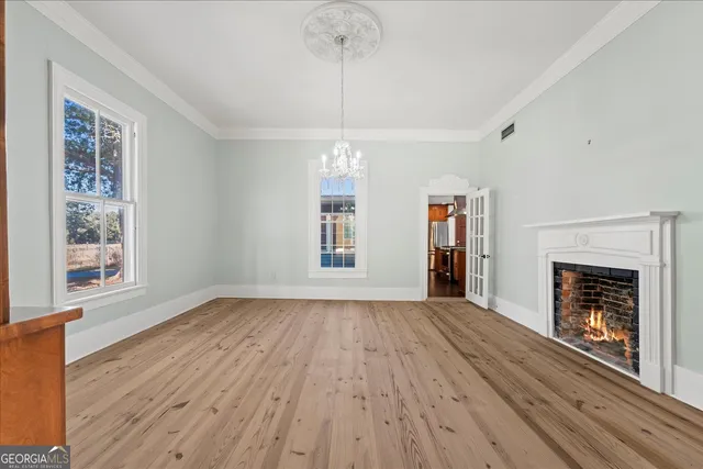 a kitchen with stainless steel appliances granite countertop a sink a stove and a wooden cabinets