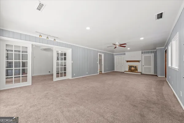 a bathroom with a tub and a glass door