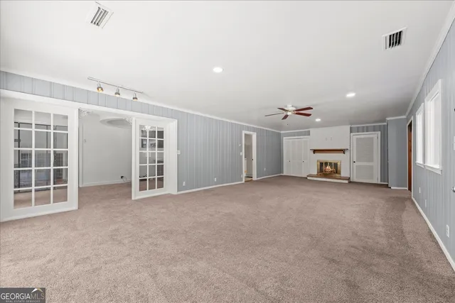 a bathroom with a tub and a glass door